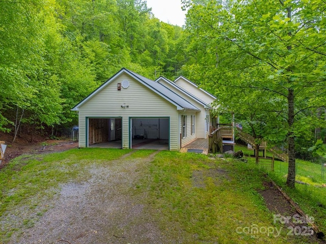 910 Hannah Mountain Rd, Otto, NC 28763 - garage featuring dirt driveway and a forest view