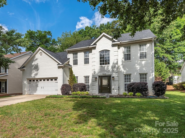 3626 Cole Mill Rd, Charlotte, NC 28270 - colonial-style house with a front yard, an attached garage, brick siding, and driveway