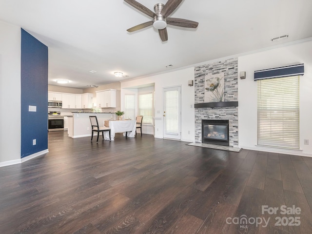 3626 Cole Mill Rd, Charlotte, NC 28270 - living area with ceiling fan, dark wood-type flooring, a tile fireplace, baseboards, and ornamental molding