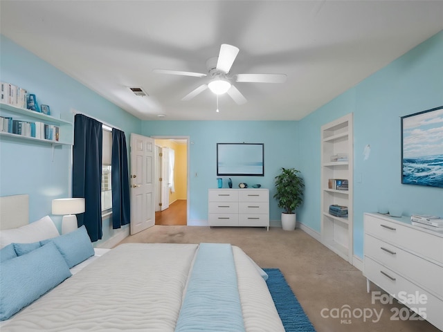 bedroom featuring light colored carpet, ceiling fan, and baseboards