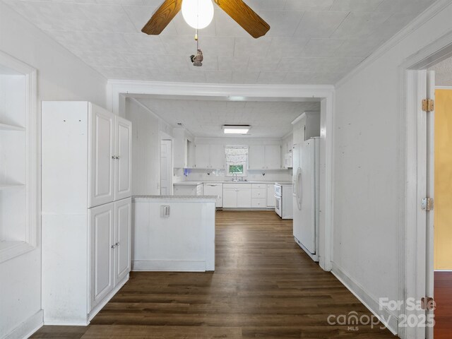 kitchen with white appliances, a ceiling fan, dark wood finished floors, white cabinets, and light countertops