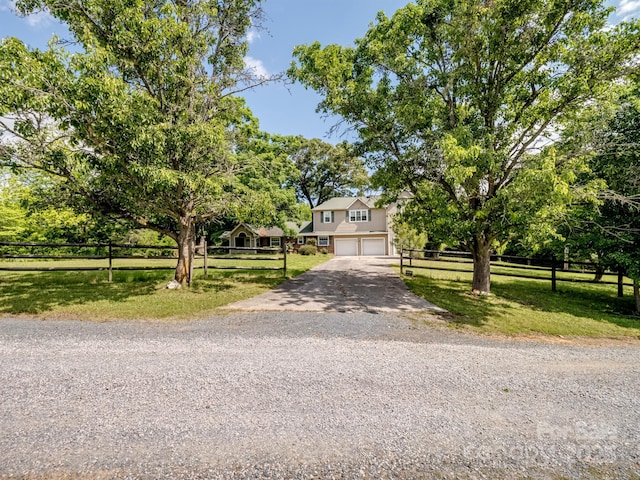 view of front of property featuring an attached garage and driveway