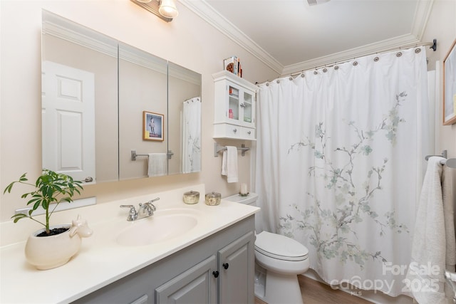 bathroom with crown molding, toilet, a shower with curtain, and vanity