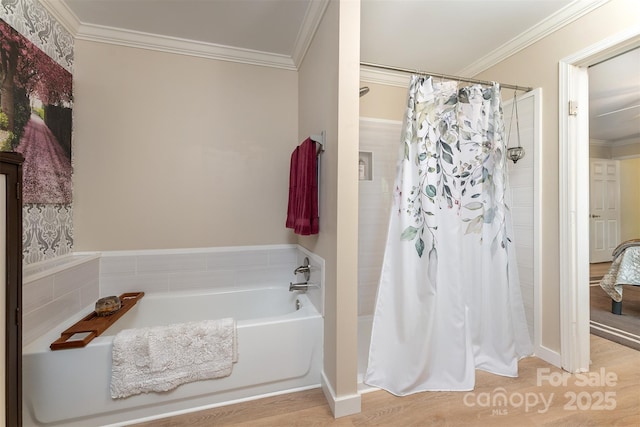 bathroom featuring ornamental molding, a shower with shower curtain, and a garden tub