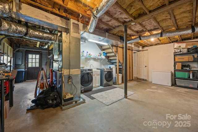 25 Alpine Way, Clyde, NC 28721 - basement featuring washer and dryer, white refrigerator, and electric panel