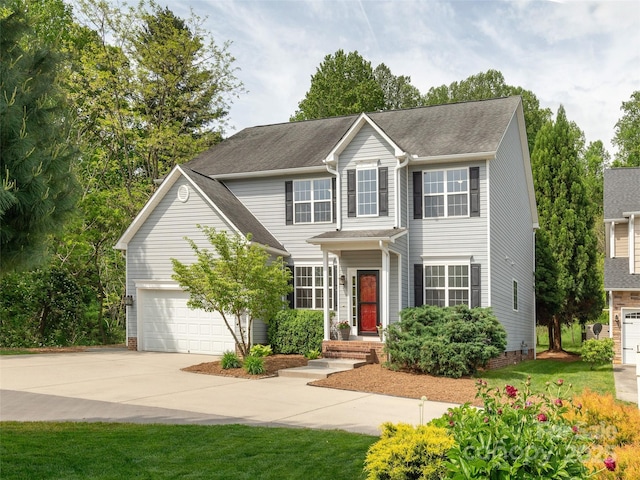 view of front of home with an attached garage and driveway