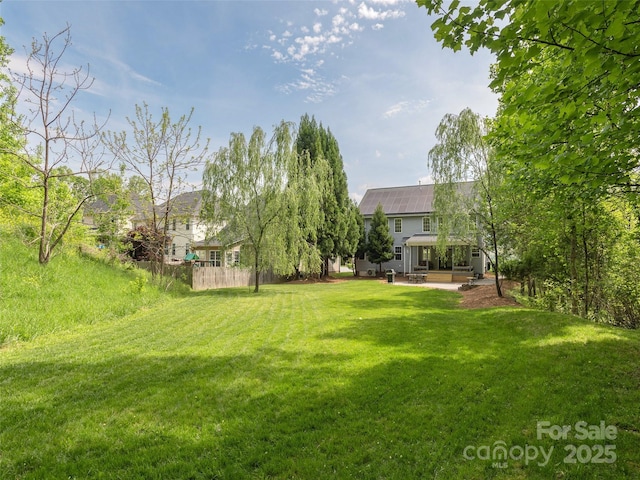 view of yard with a patio area and fence