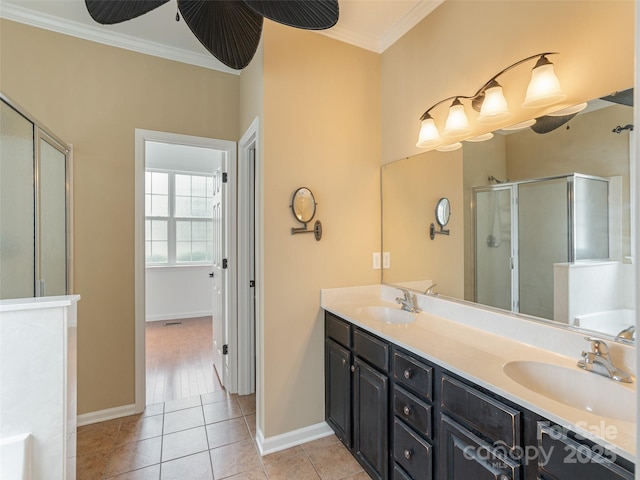15 Dansford Ln, Arden, NC 28704 - bathroom with a stall shower, crown molding, double vanity, tile patterned floors, and baseboards