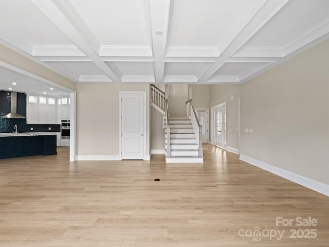 709 Cavesson Way, Monroe, NC 28110 - unfurnished living room featuring stairs, coffered ceiling, beam ceiling, light wood finished floors, and ornamental molding