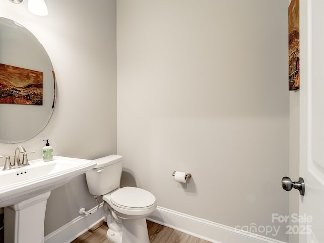 709 Cavesson Way, Monroe, NC 28110 - half bathroom featuring wood finished floors and toilet