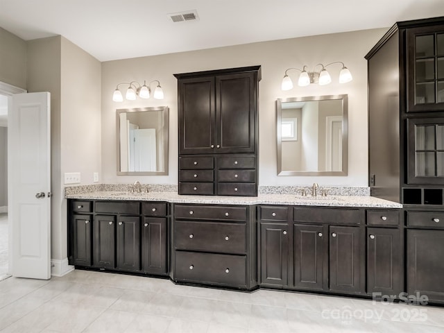 709 Cavesson Way, Monroe, NC 28110 - bathroom featuring double vanity and tile patterned floors