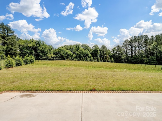 709 Cavesson Way, Monroe, NC 28110 - view of green lawn featuring a wooded view