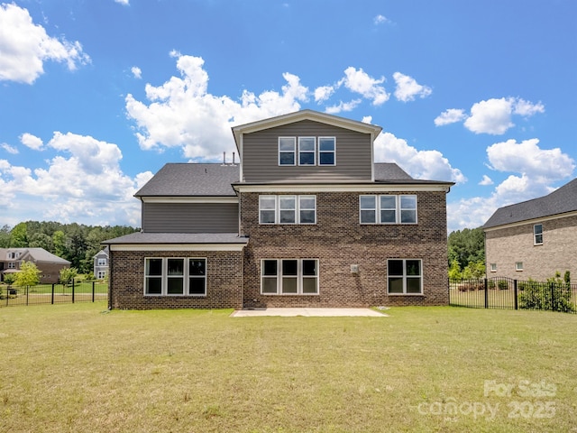 709 Cavesson Way, Monroe, NC 28110 - rear view of house with brick siding, a fenced backyard, a patio area, and roof with shingles