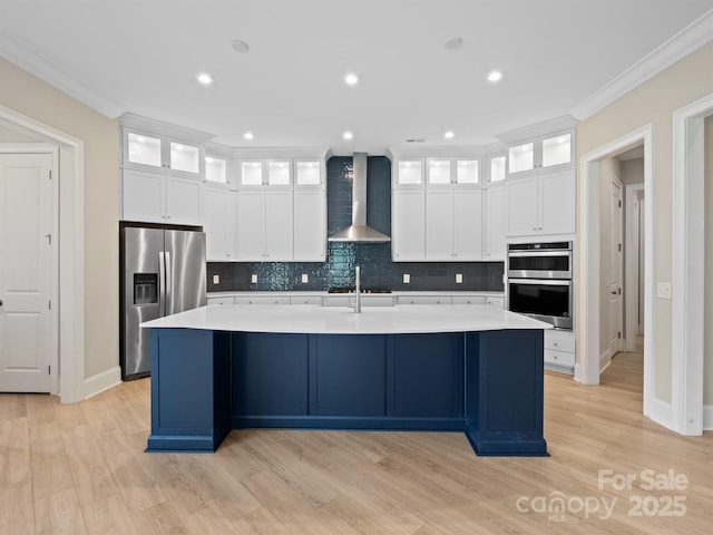 709 Cavesson Way, Monroe, NC 28110 - kitchen featuring appliances with stainless steel finishes, wall chimney exhaust hood, a spacious island, backsplash, and crown molding