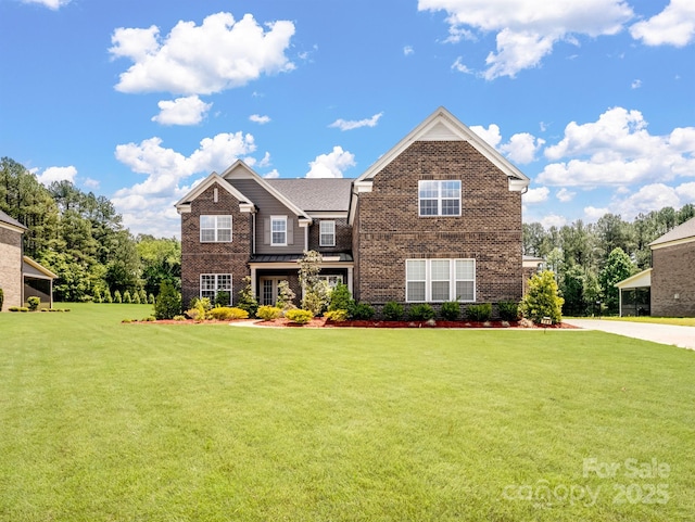 709 Cavesson Way, Monroe, NC 28110 - view of front of home featuring brick siding and a front lawn