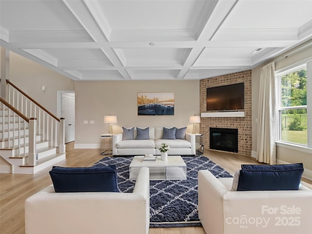 709 Cavesson Way, Monroe, NC 28110 - living room featuring wood finished floors, coffered ceiling, stairway, beam ceiling, and a fireplace