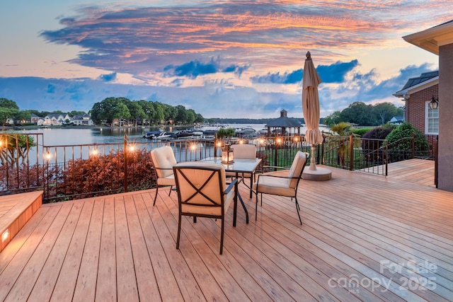 deck at dusk with a water view
