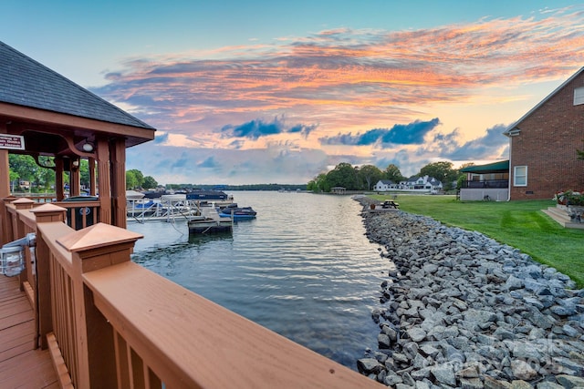exterior space with a yard and a water view