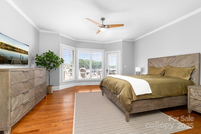 bedroom featuring baseboards, ornamental molding, access to outside, and light wood-type flooring