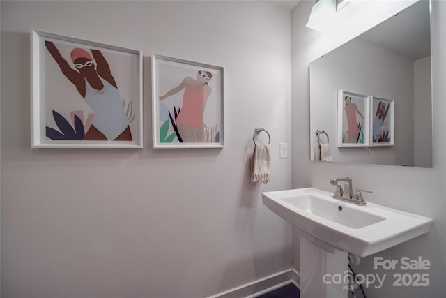 bathroom featuring baseboards