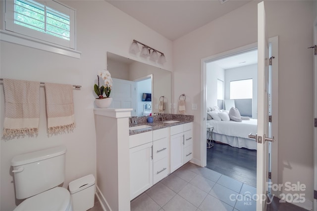 full bathroom featuring healthy amount of natural light, toilet, ensuite bathroom, and tile patterned floors