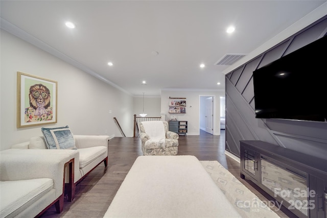 living area with ornamental molding, dark wood-style floors, recessed lighting, and baseboards