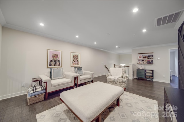 living room with baseboards, crown molding, recessed lighting, and dark wood finished floors