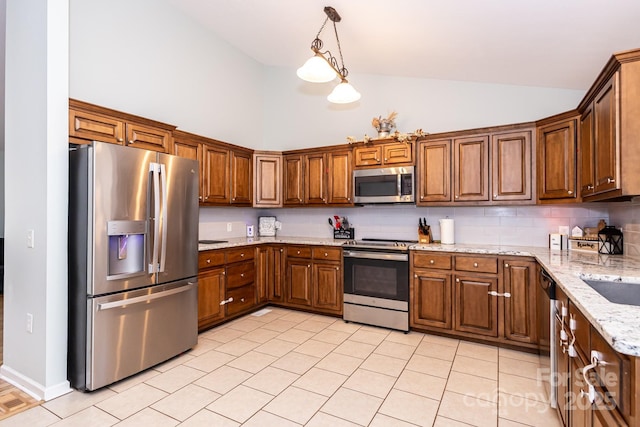 kitchen featuring stainless steel appliances, brown cabinets, and high vaulted ceiling