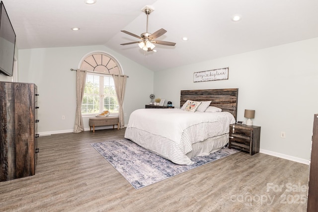 bedroom with wood finished floors, recessed lighting, vaulted ceiling, a ceiling fan, and baseboards