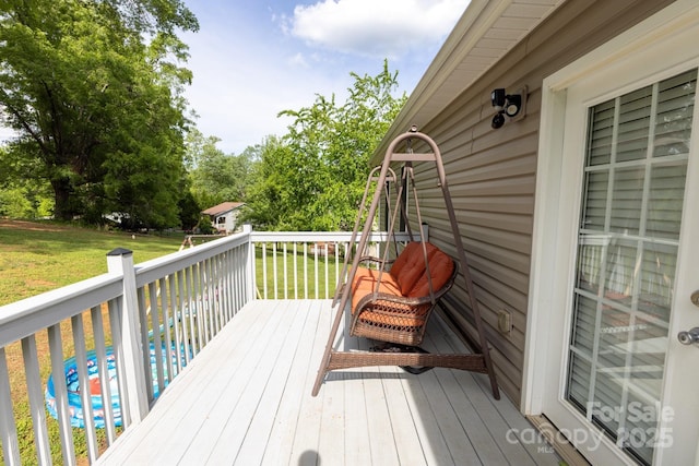 deck featuring a yard
