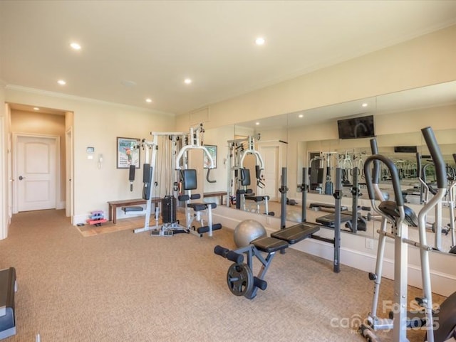 gym with baseboards, recessed lighting, and carpet