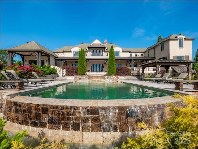 pool featuring a patio area, cooling unit, french doors, and a gazebo