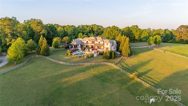 aerial view with a rural view and a wooded view
