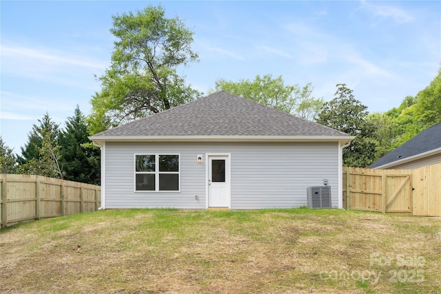 401 Groves St, Lowell, NC 28098 - rear view of property with cooling unit, a shingled roof, and a gate
