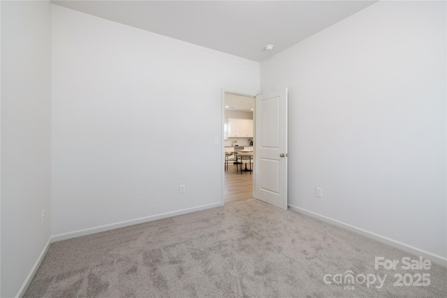 401 Groves St, Lowell, NC 28098 - carpeted spare room featuring baseboards