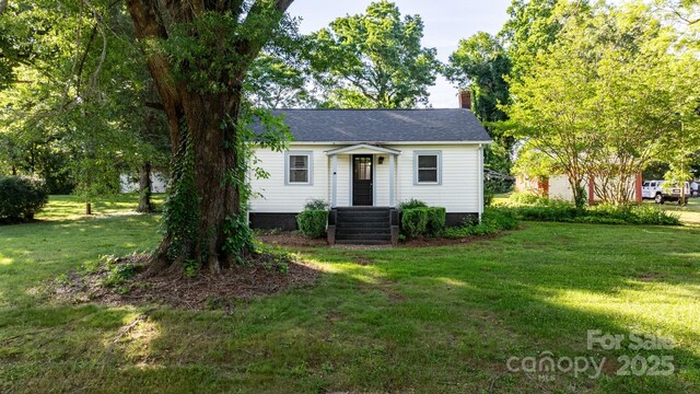 116 Barnes Ln, Stony Point, NC 28678 - view of front of property with a front yard and a chimney