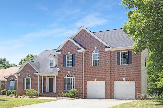1465 Porters Ct, Concord, NC 28025 - view of front of home with driveway, brick siding, a garage, and a shingled roof