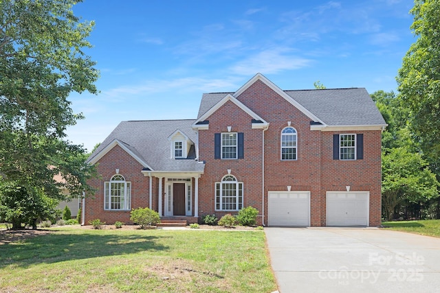 1465 Porters Ct, Concord, NC 28025 - view of front of home with concrete driveway, a garage, a front lawn, brick siding, and roof with shingles