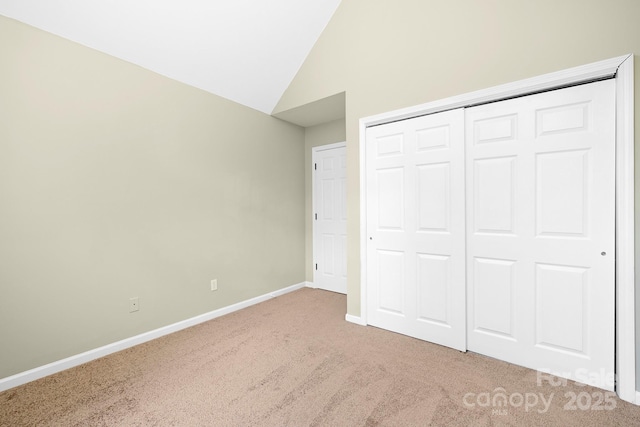 1465 Porters Ct, Concord, NC 28025 - unfurnished bedroom featuring carpet floors, lofted ceiling, baseboards, and a closet