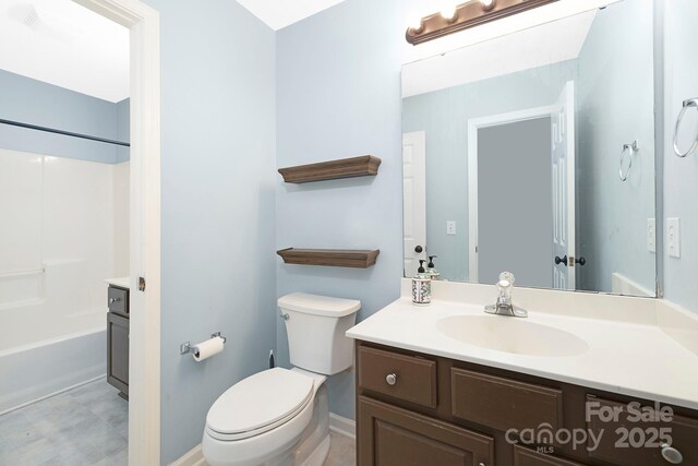 1465 Porters Ct, Concord, NC 28025 - full bathroom featuring vanity, toilet,  shower combination, and baseboards