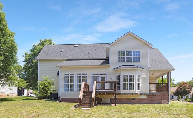 1465 Porters Ct, Concord, NC 28025 - rear view of property featuring a deck, a yard, central AC, a shingled roof, and stairway