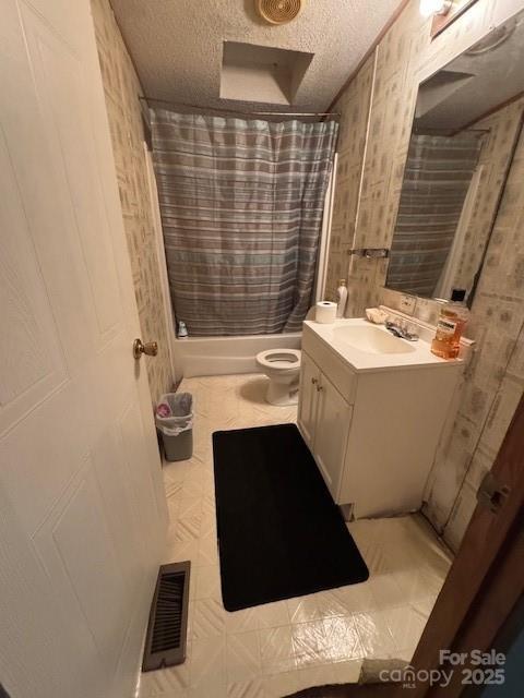 full bath with toilet, shower / bath combo, a textured ceiling, visible vents, and vanity