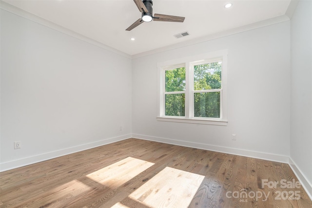 2224 Highland St, Charlotte, NC 28208 - unfurnished room with baseboards, crown molding, a ceiling fan, wood finished floors, and recessed lighting