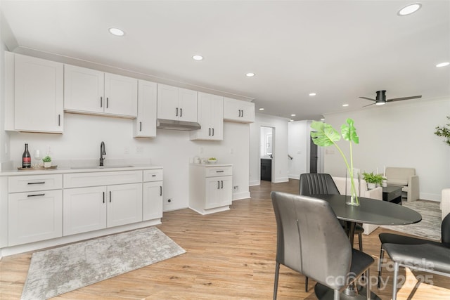 2224 Highland St, Charlotte, NC 28208 - kitchen featuring a sink, recessed lighting, ceiling fan, white cabinets, and baseboards