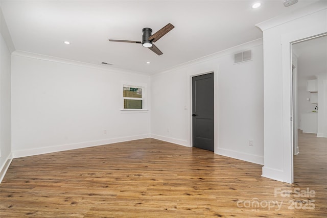 2224 Highland St, Charlotte, NC 28208 - empty room featuring ornamental molding, a ceiling fan, wood finished floors, baseboards, and recessed lighting