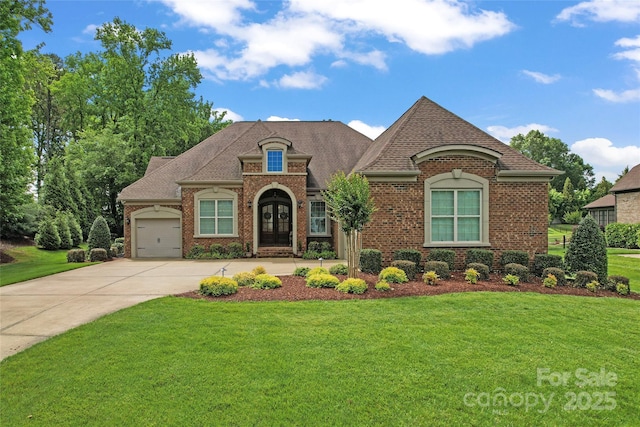1400 Delaney Dr, Matthews, NC 28104 - french country style house featuring brick siding, a front lawn, concrete driveway, an attached garage, and roof with shingles