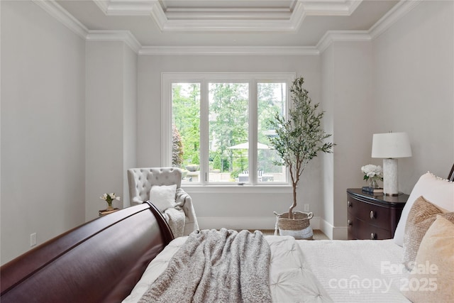 bedroom featuring multiple windows, crown molding, baseboards, and a tray ceiling