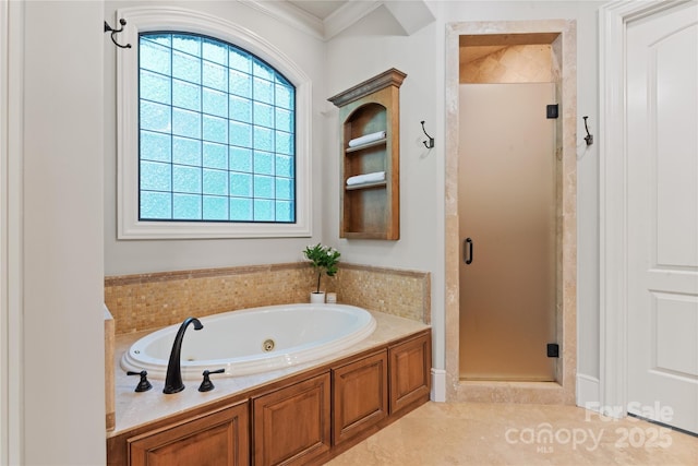 bathroom with a stall shower, a whirlpool tub, healthy amount of natural light, crown molding, and tile patterned flooring