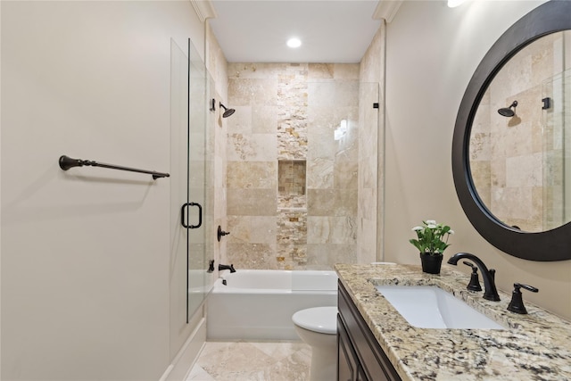 bathroom featuring combined bath / shower with glass door, vanity, toilet, and recessed lighting