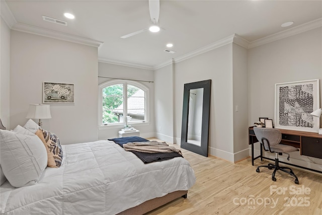 bedroom featuring light wood finished floors, crown molding, baseboards, recessed lighting, and a desk